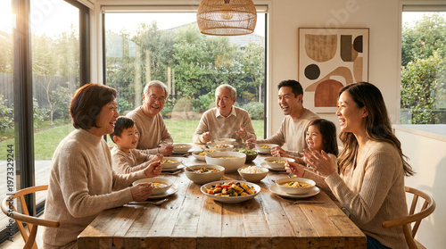 Asian Multi-Generational Family Sharing Meal at Rustic Dining Table in Sunlit Modern Dining Room