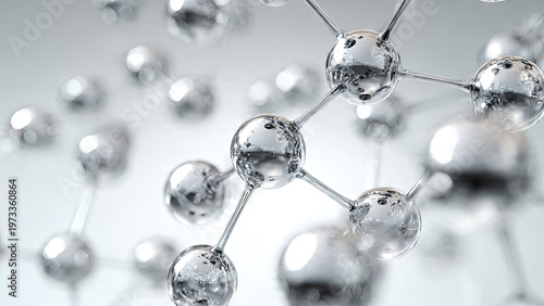 Shiny metallic silver glass molecular ball and stick structure floating against clean light blue grey background with copy space