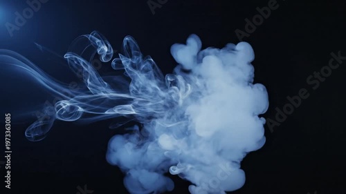 Abstract blue smoke swirling and dissipating against a dark background