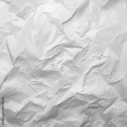 A crumpled white paper texture background with deep creases and folds