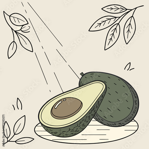A cut avocado on a wooden plate with leaves