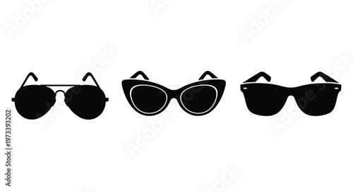 A collection of four different pairs of sunglasses in a dark silhouette