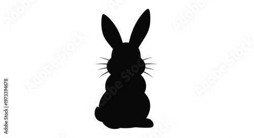 A striking black silhouette of a rabbit facing away from the viewer silhouette