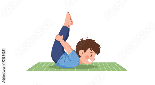 Happy young boy practicing dhanurasana or bow yoga pose on green mat for physical health and early childhood development.