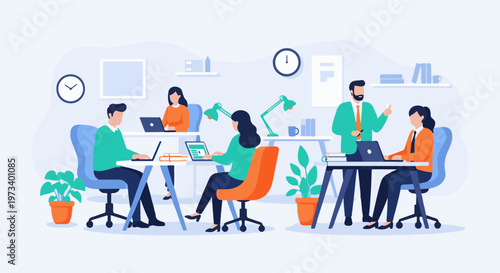 Four colleagues work at computers in a bright, modern office space