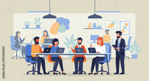 People collaborate in a modern office, working on laptops around a table and at desks