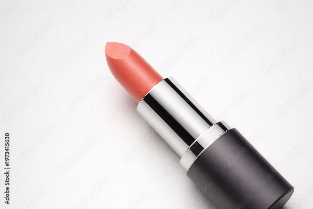 Fototapeta premium Coral Lipstick Tube on Clean White Background