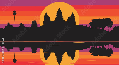 Angkor Wat silhouette reflected in water at sunset.