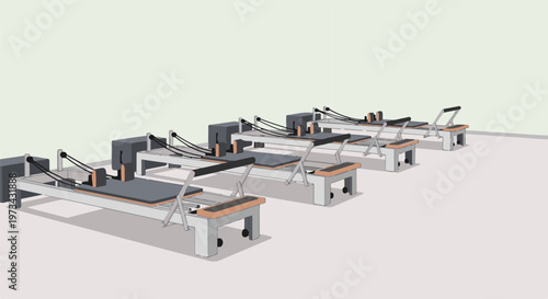 Row of exercise reformers on a light-colored floor, with a pale green wall behind