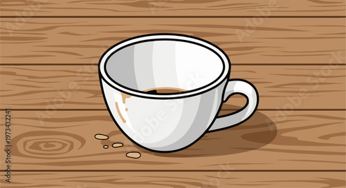 A white coffee cup with brown liquid and some coffee grounds sits on a wooden surface