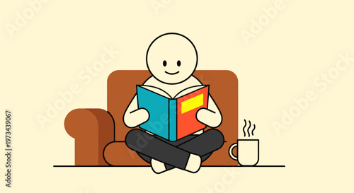 Person reading book on couch with hot drink.