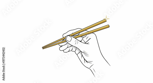 A hand holds golden chopsticks with a sparkling accent on the tip