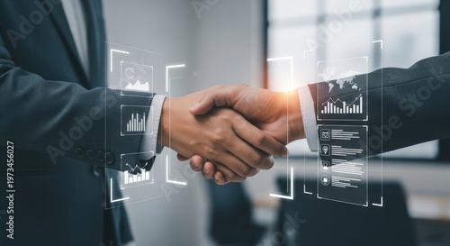 Two professionals shaking hands with digital data overlays representing business partnership