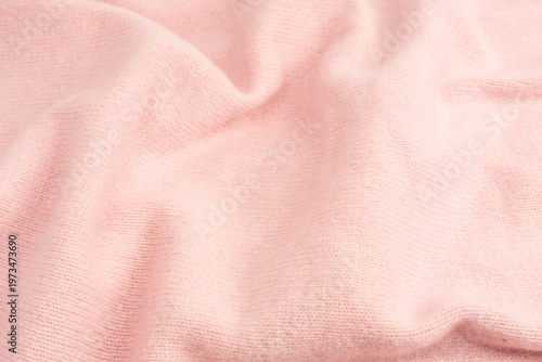 Soft pink cashmere sweater texture background.