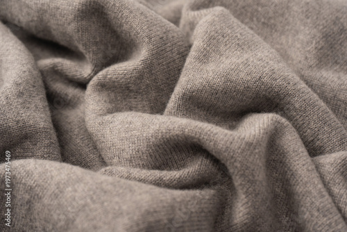 Soft grey merino wool sweater texture as a background.