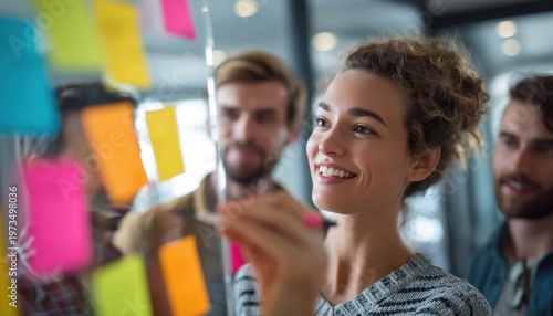 In The Office, A Creative Business Team Engages In Writing On Adhesive Notes To Collaborate And Brainstorm Ideas Efficiently And Effectively.