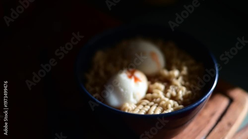 Noodles in a bawl with hard boiled eggs natural authentic light, selective focus food background video