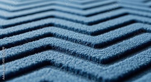 Blue textured carpet with geometric chevron pattern for modern interior design