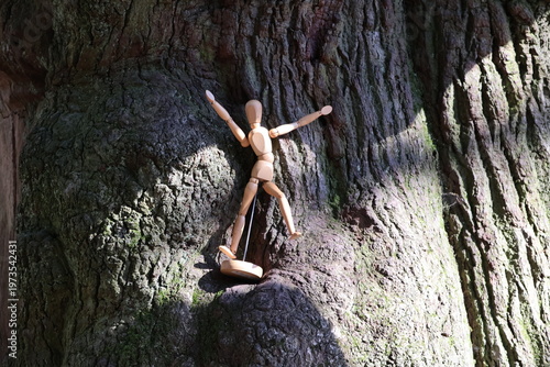 wooden mannequin in the woods.