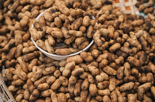 Boiled peanuts in shell in a white bowl at a local street market for healthy snack marketing