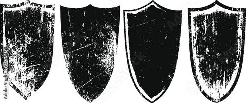 set of four distressed medieval shields with different rough textures and shapes