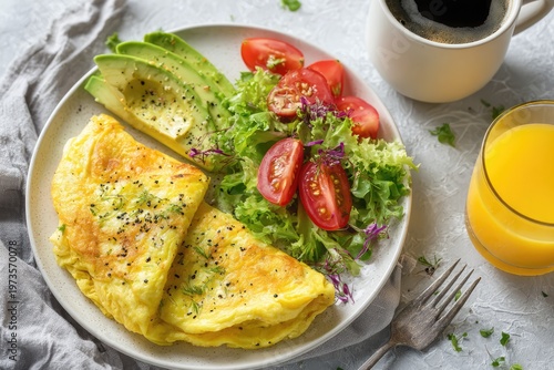 Delicious Omelette Breakfast with Avocado and Fresh Salad.