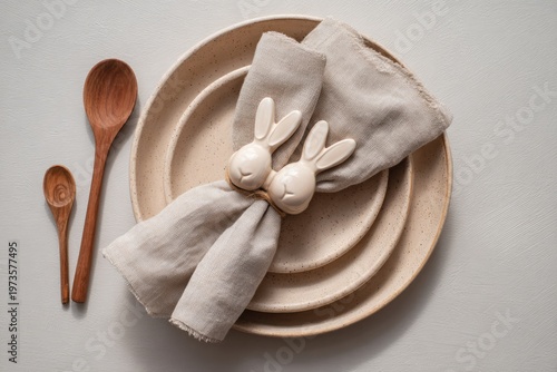 Easter Table Setting with Bunny Napkin Rings and Wooden Spoons.