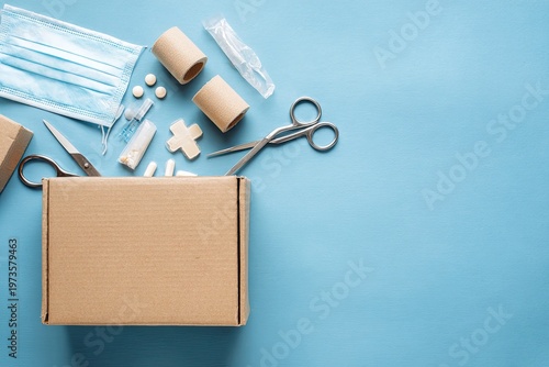 Medical Supplies Boxed And Arranged On A Blue Background.