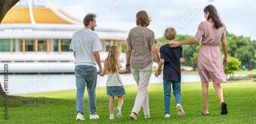 Happiness family outdoor joyful enjoying nature bonding in nature intergenerational happiness. Multigenerational family walking in park outdoor fun lifestyle relaxing smiling walking connection
