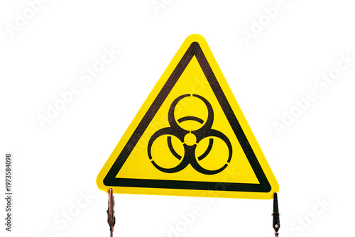Warning sign shows radiation symbol in bright yellow with black markings for safety precautions in hazardous areas