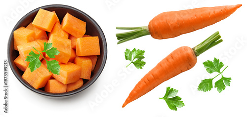 sliced carrot in black bowl isolated on white background. clipping path