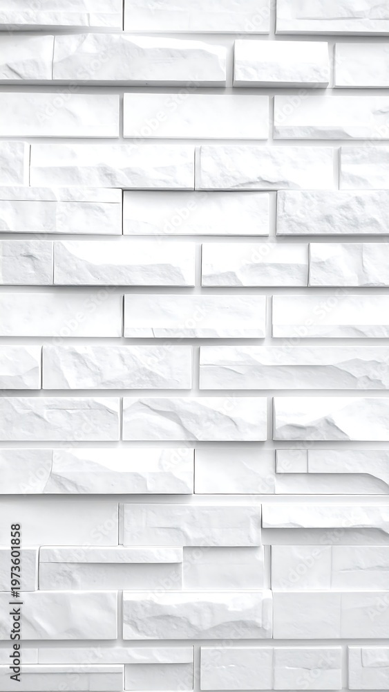 Fototapeta premium Close-up, high-angle view of a textured, white brick wall. The rectangular bricks vary in size and are arranged in a staggered pattern