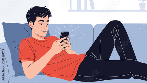 Young man relaxing on a comfortable blue sofa while looking at his smartphone with light rays coming from the screen in a living room.