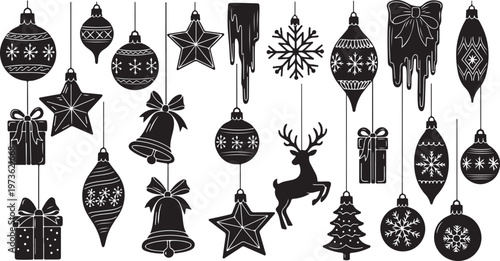 Black and white Christmas ornaments hanging on strings together