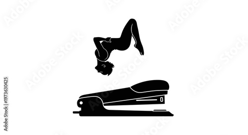 Gymnast performing a backflip over a stapler.