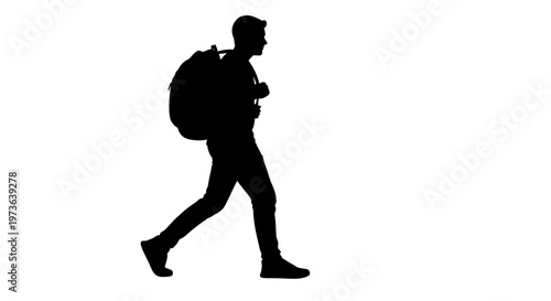 Silhouette of a person walking with a backpack.