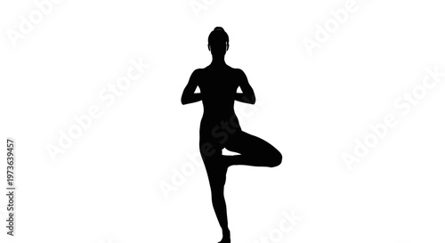 Silhouette of a woman in a yoga tree pose.
