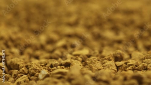 Granulated Instant coffee. Macro view of aromatic brown granules texture
