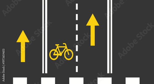 Top view of a dedicated bicycle lane with an upward arrow on a dark asphalt road.