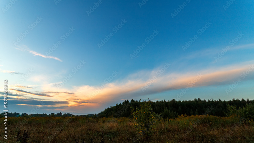 Obraz premium Sky with light clouds. Summer sky at sunrise or sunset.