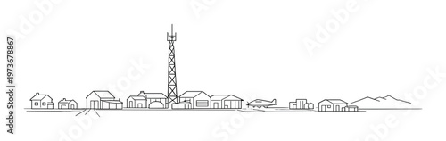 Small airfield with parked airplane and radio tower on plain