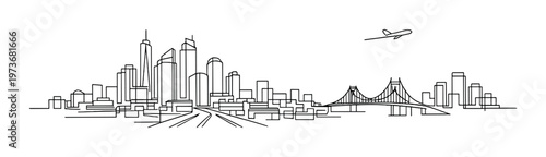 City skyline with airplane approaching bridge over waterfront