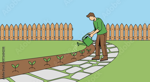 Gardener watering young plants in a garden bed along a stone path