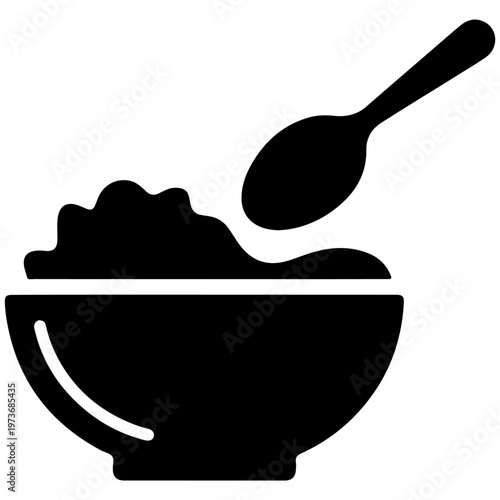 A bowl of porridge being served with a spoonful of additional topping