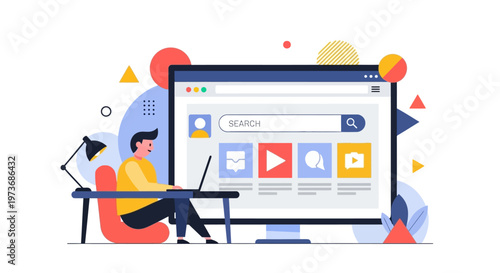 Man sitting at desk working on laptop next to large computer screen with search bar and icons.