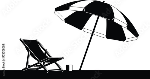 Relaxing beach scene with a deck chair and large beach umbrella on sandy shore