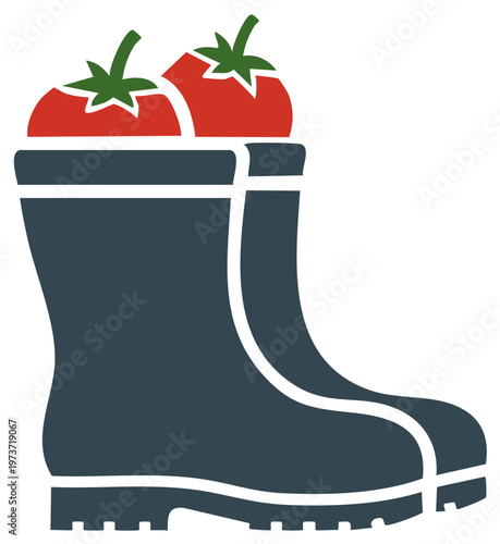 Pair of gardening boots filled with red tomatoes representing fresh harvest
