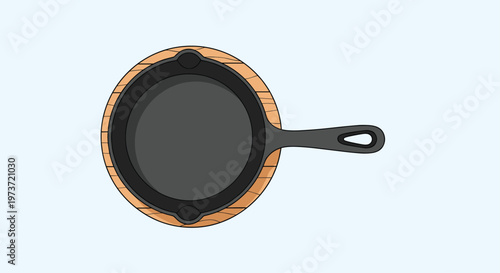 Overhead view of a black cast iron skillet placed on a round wooden board highlights a rustic style of cooking and serving food in the kitchen.