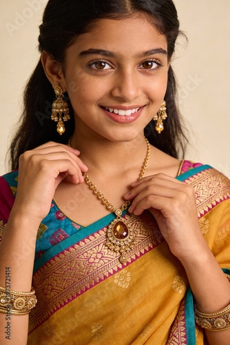 Smiling young Indian girl wearing traditional jewellery