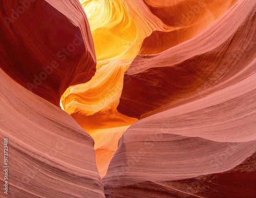 a vast canyon with layered red and yellow rock walls, rugged cliffs, and deep shadows under a clear, bright sky